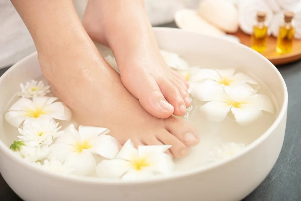 Foot soaking in water for pedicure and foot massage