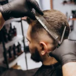 A man getting a haircut at salon