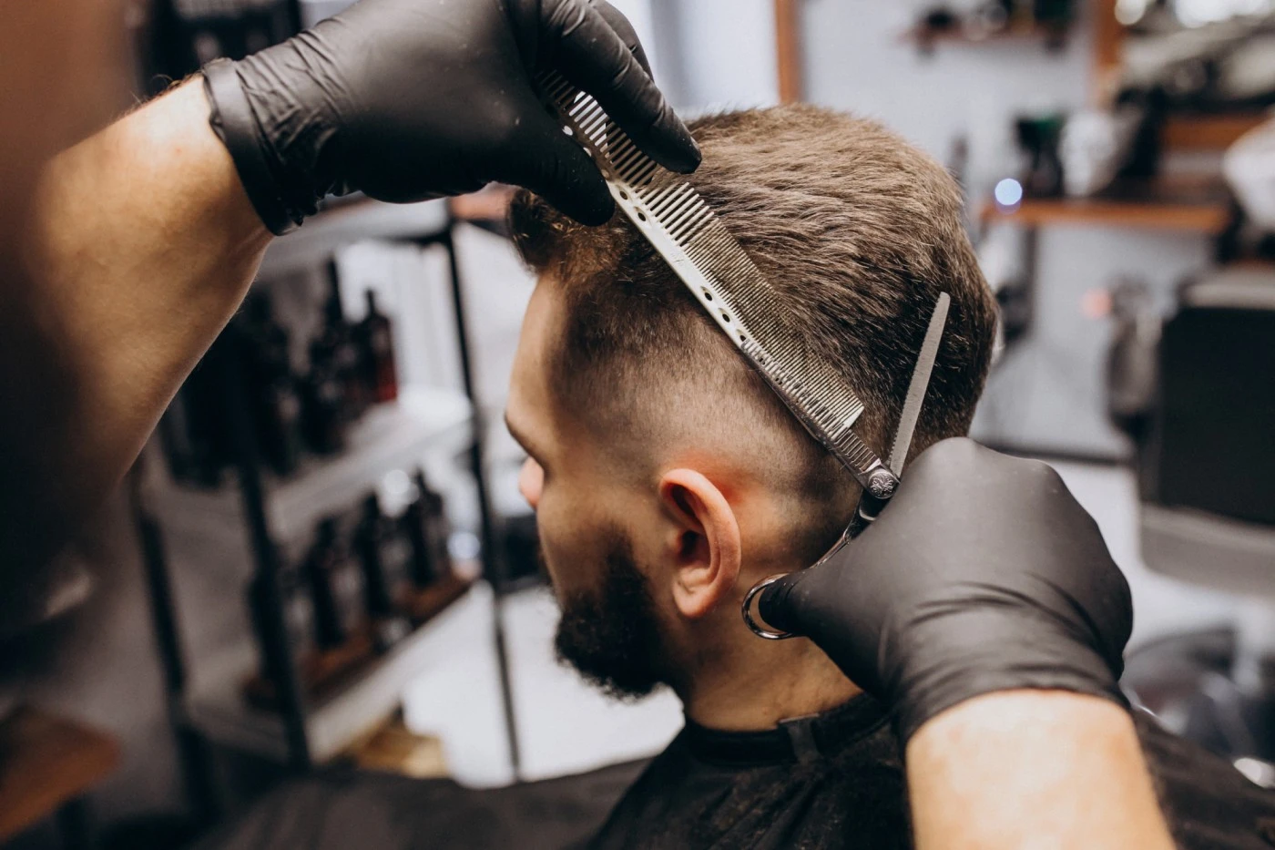 A man getting a haircut at salon